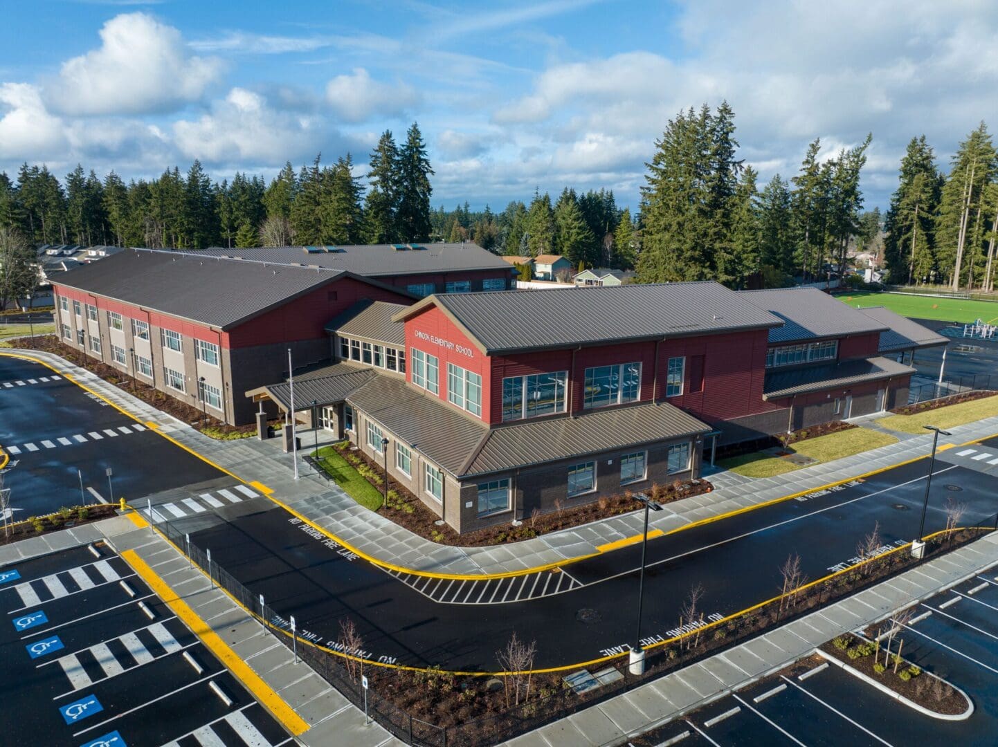 An aerial view of a school building and parking lot.