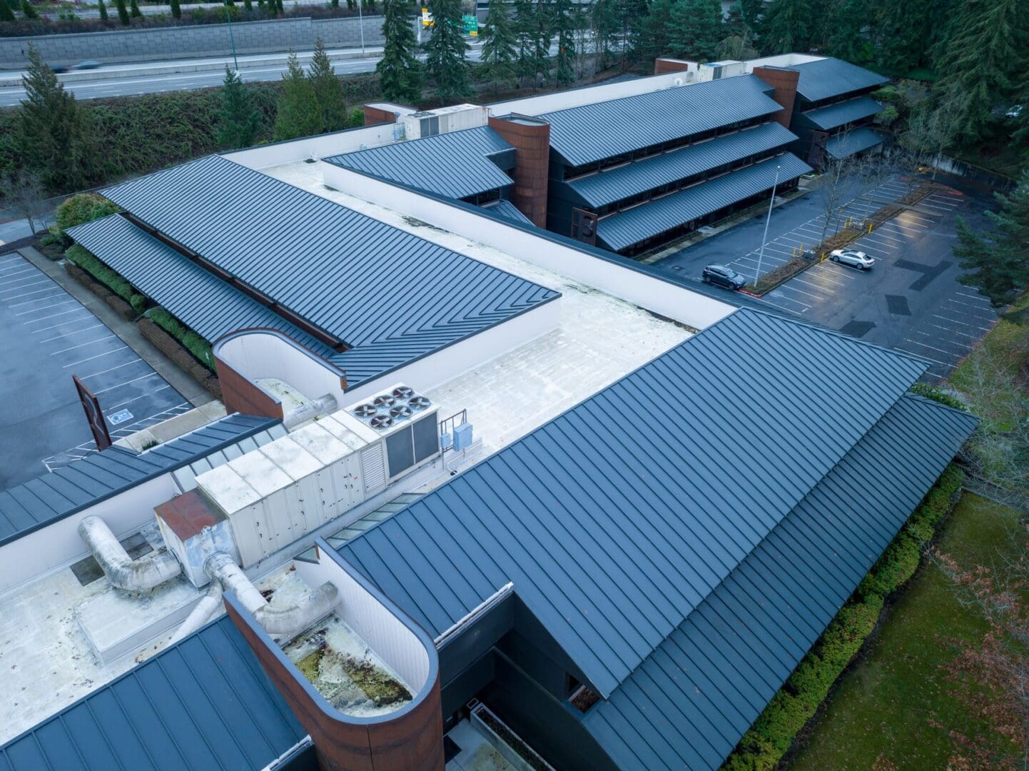 An aerial view of a building with a metal roof.